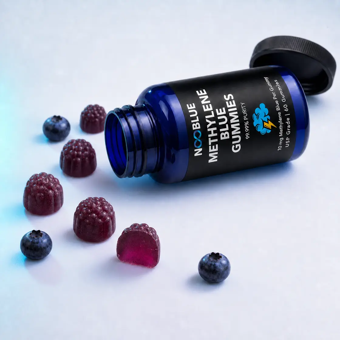 Open NooBlue bottle with deep-purple Wild Blueberry gummies and a translucent cutaway