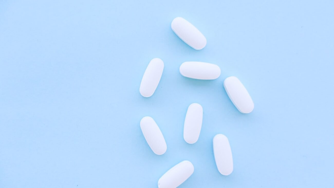Methylene blue and vitamin C supplement capsules on a clean surface