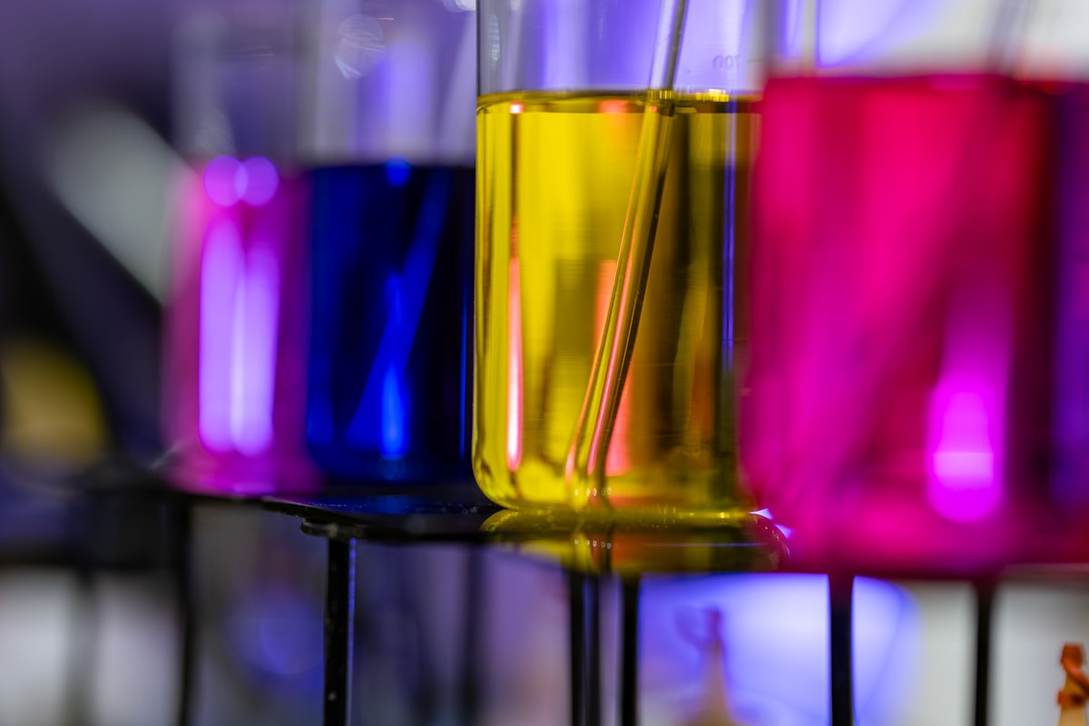 methylene blue vs crystal violet compared as blue and violet dye solutions in laboratory vials