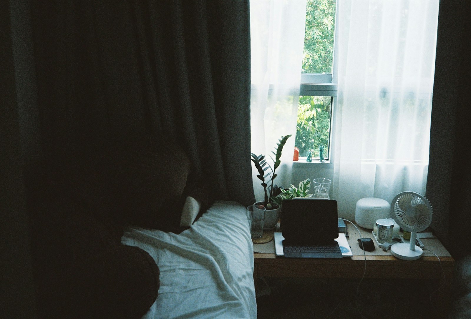 Quiet sunlit bedroom with white linen, illustrating the rest stage of how to recover from burnout
