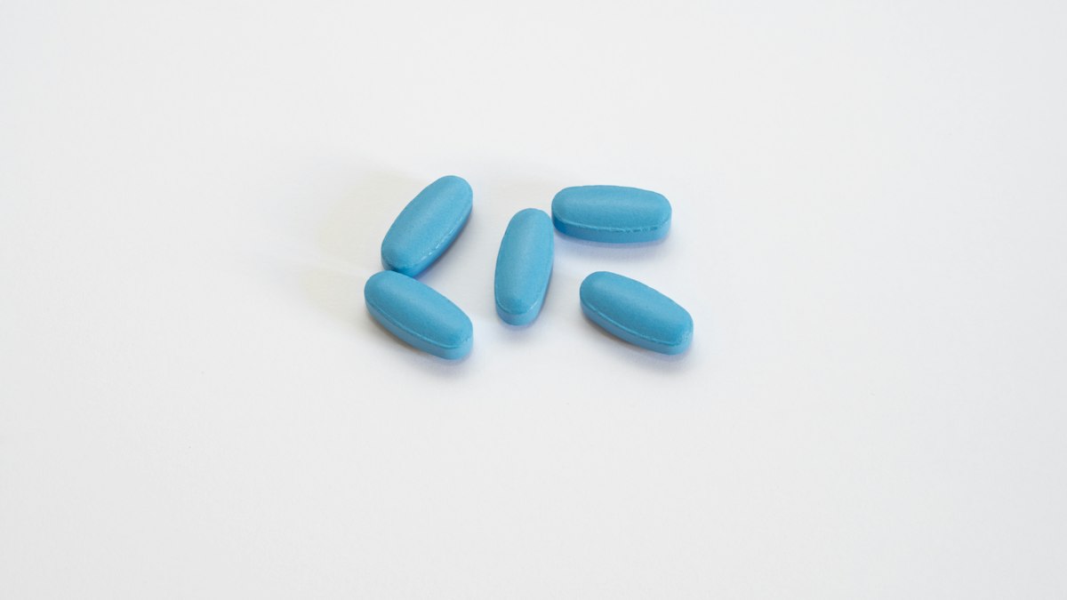 Chase Hughes methylene blue gummies explained beside blue supplement capsules on a white surface