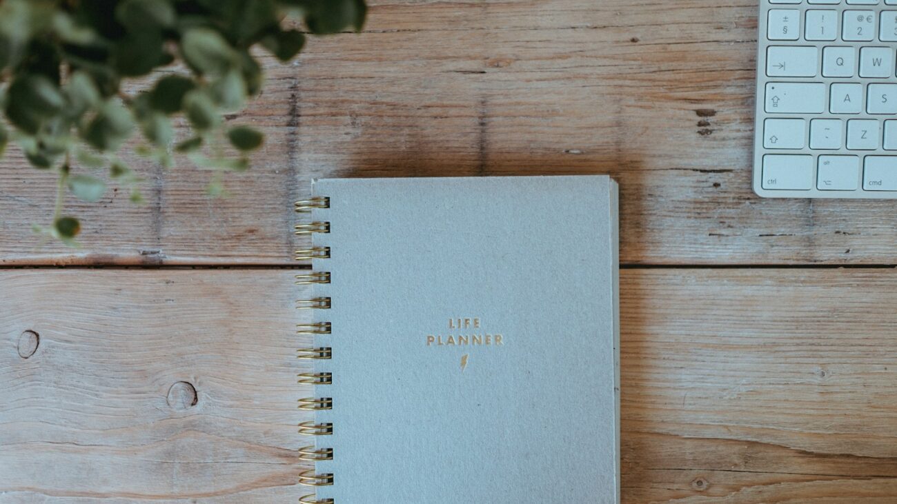 Dopamine supplements guide: a planner notebook on a wooden desk for a fresh, motivated start