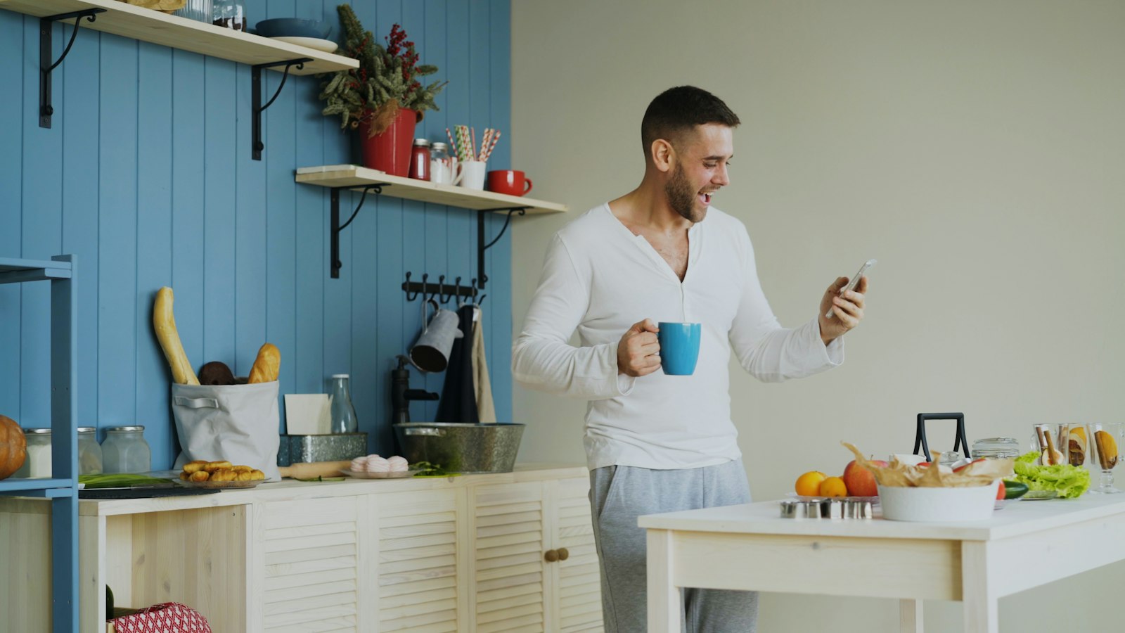 Best energy supplements for men: a man with a morning coffee in a bright kitchen