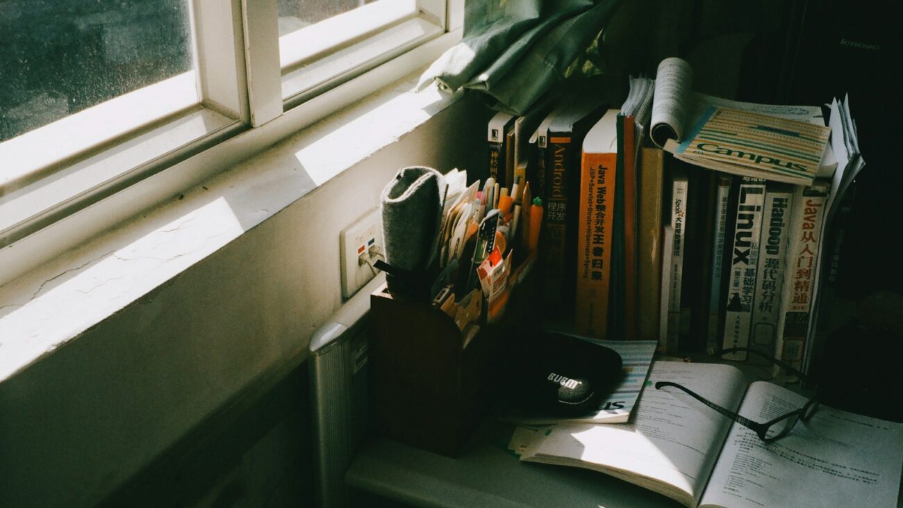 Best memory supplements guide: books and reading glasses on a sunny table by the window