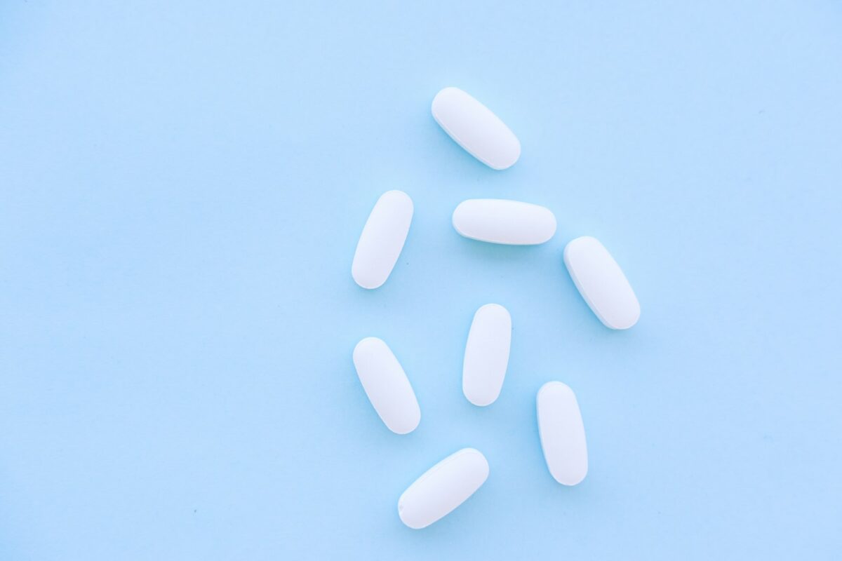 NooBlue vs Troscriptions methylene blue comparison, pills on a blue table